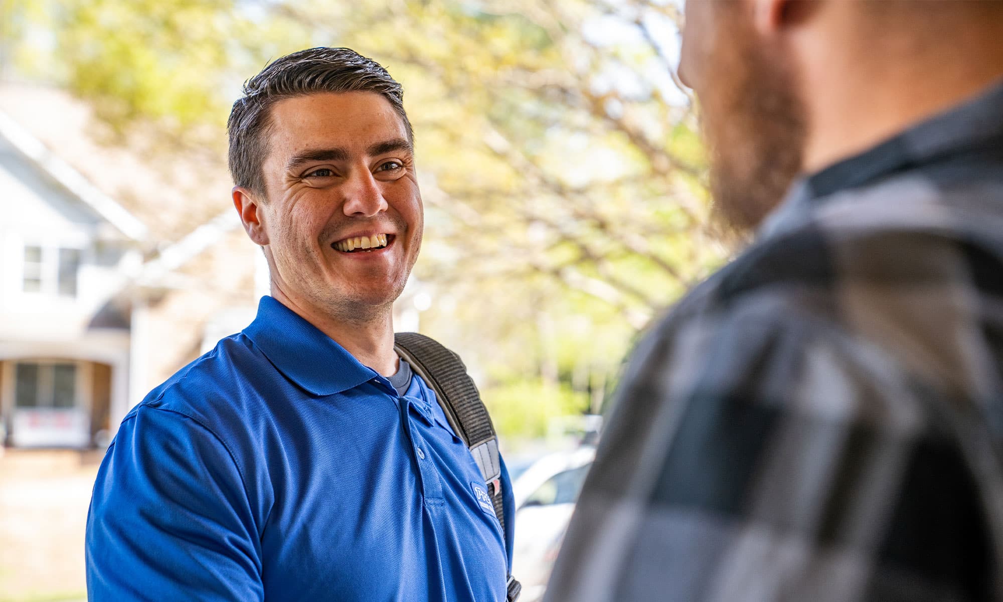a man wearing a blue shirt