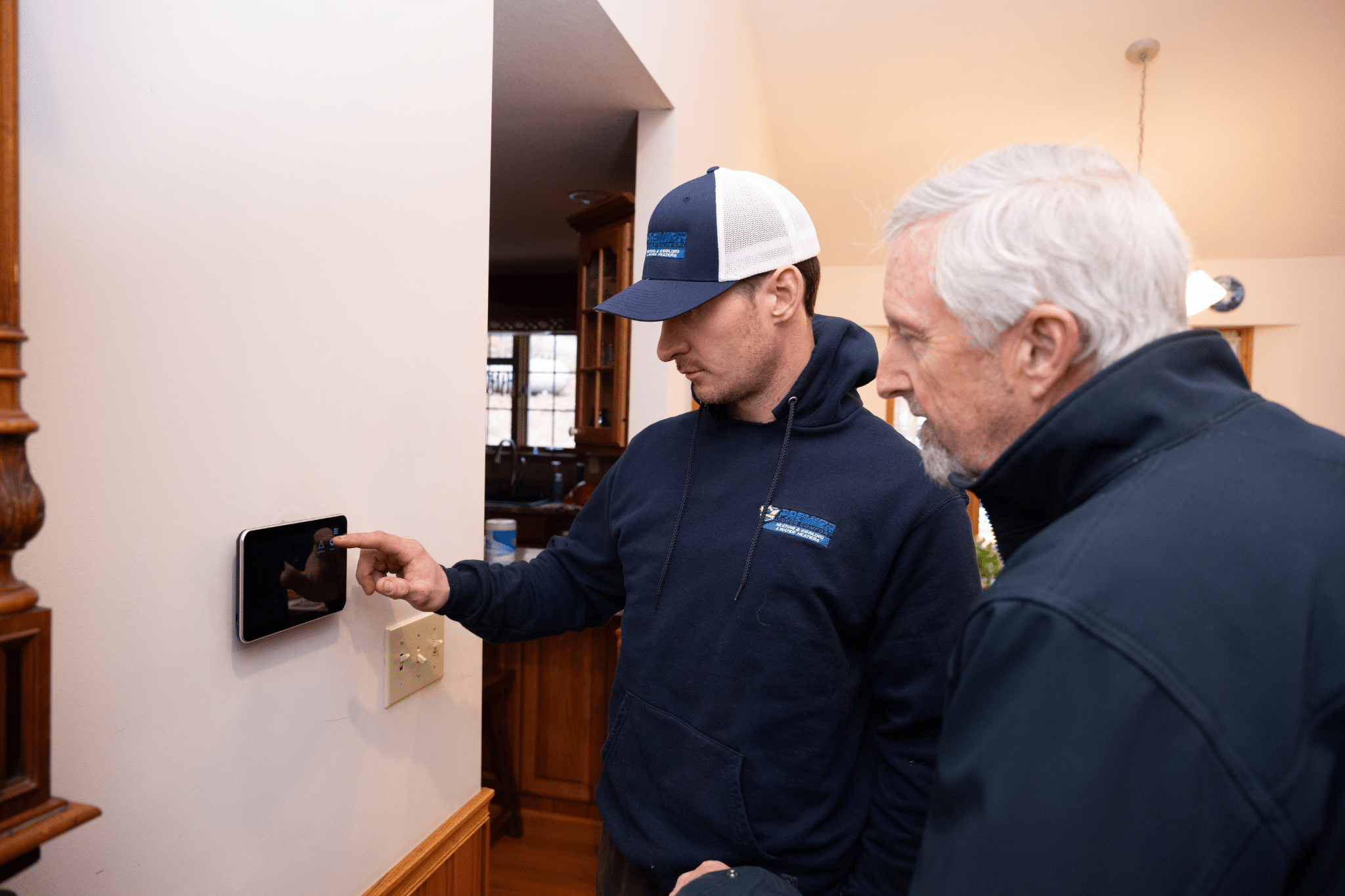 Premier Indoor Comfort NC service tech with customer